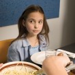 An adoptee imagining life in a different family, watching another mother serve spaghetti