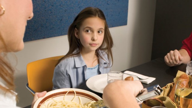 An adoptee imagining life in a different family, watching another mother serve spaghetti